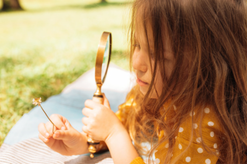 How School Leaders Can Create a Culture of Curiosity Child with Magnifying Glass
