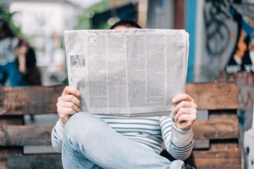Anonymous Person with Newspaper How to Teach with Current Events