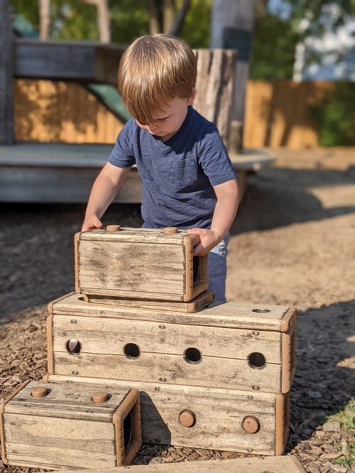 Child Stacking Blocks Evergreen School