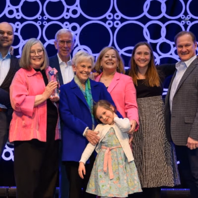 Susie & David Shelton-Dodge (and family) receiving the 2023 Living Legacy award at The Montessori Event in Boston, MA.